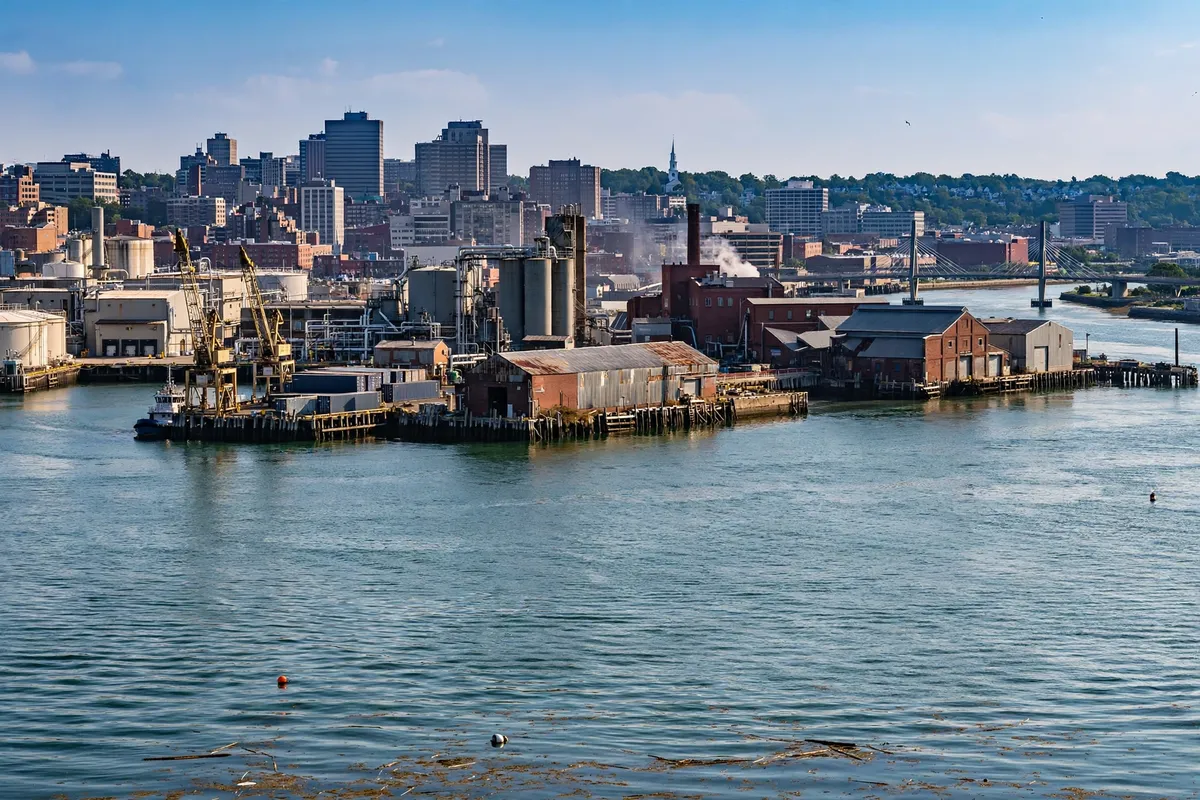 A city skyline along a harbour in Connecticut, representing Bridgeport, the largest city in the 203 area code region.