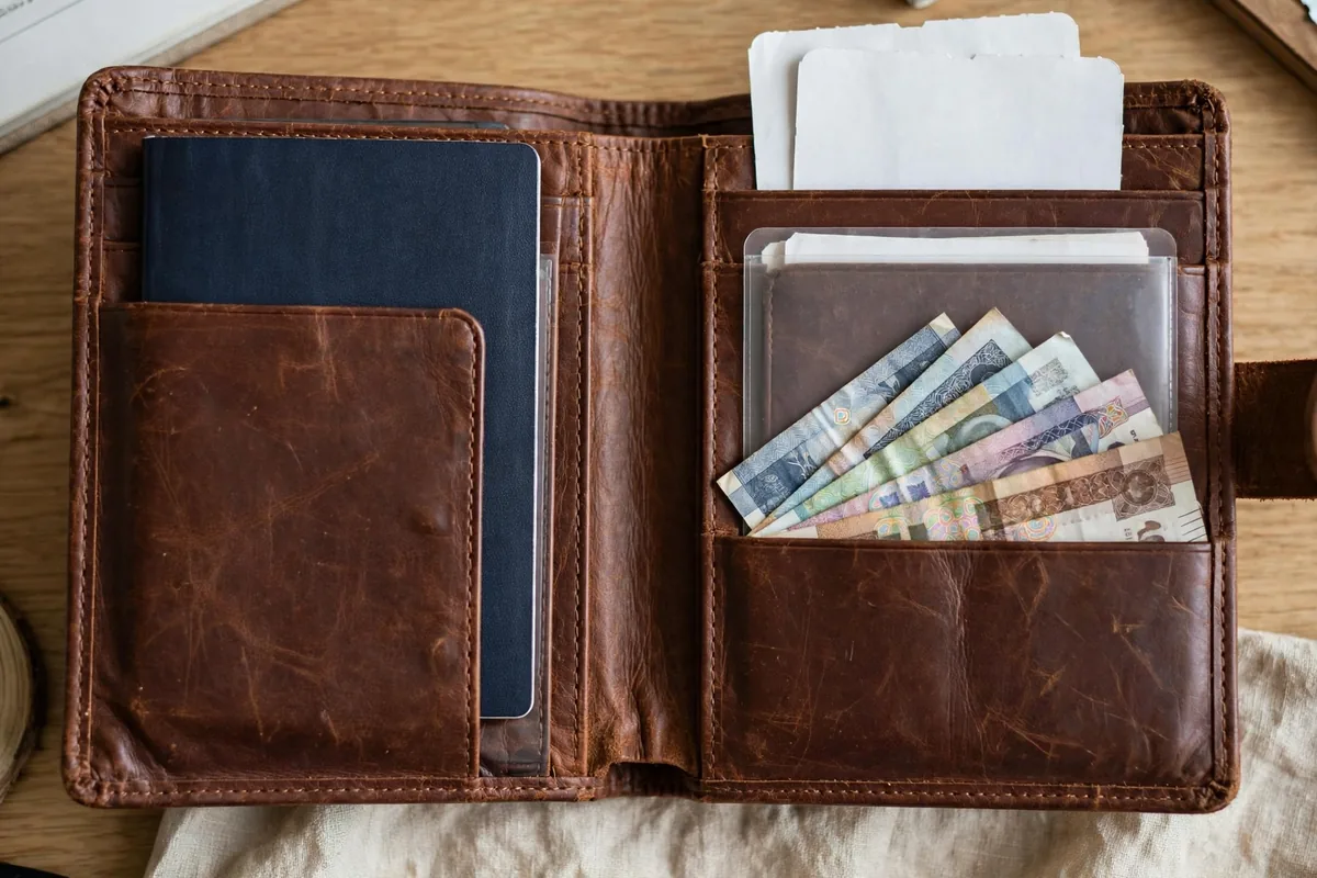 Best travel wallets arranged with a passport, cards and boarding passes